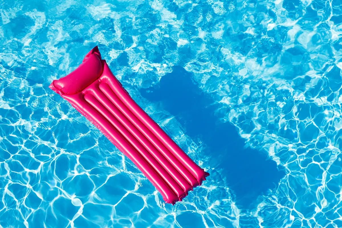 a pink inflatable pool mattress.