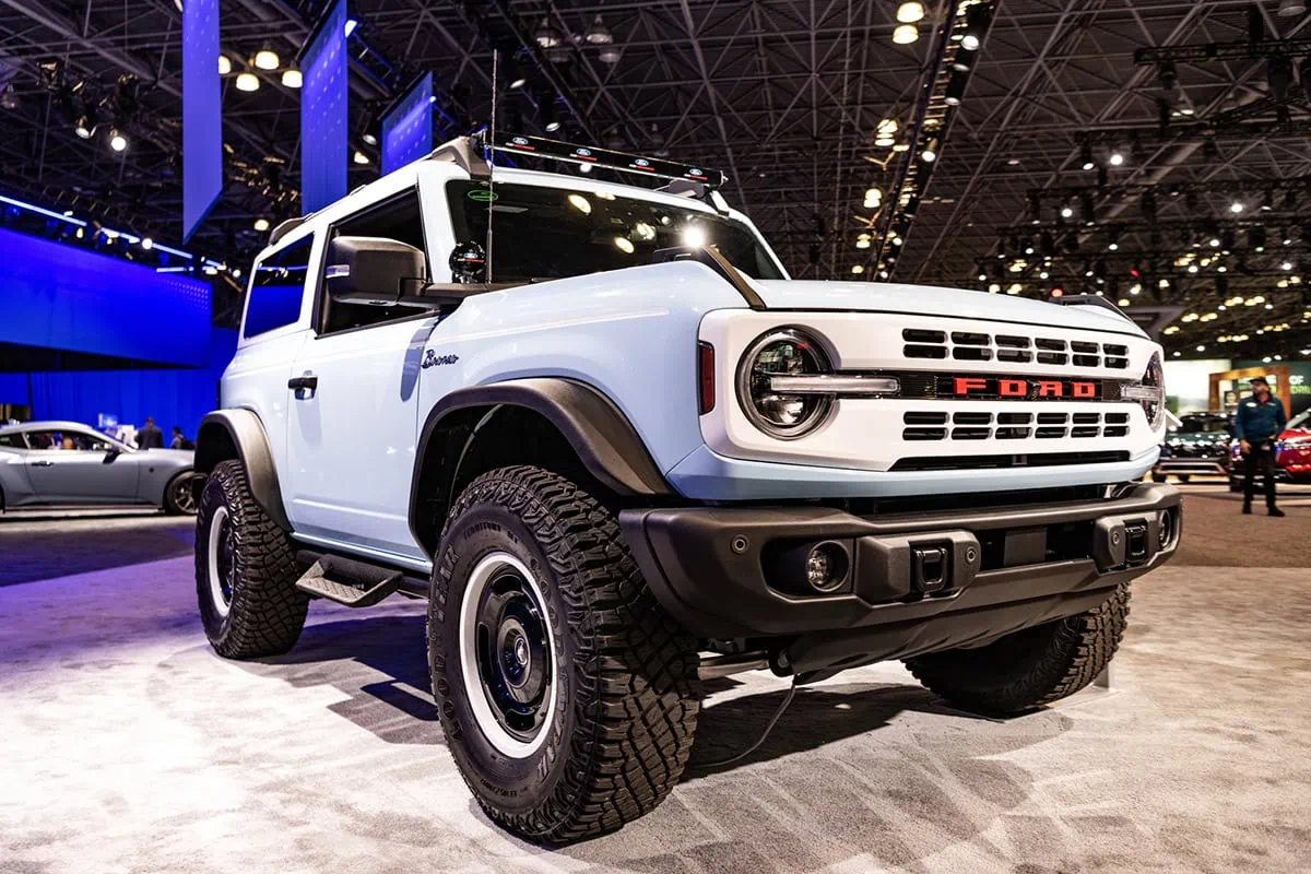 a ford bronco at a car show.