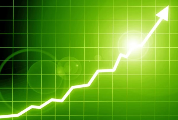 a white arrow heading steadily up and to the right against a green background.