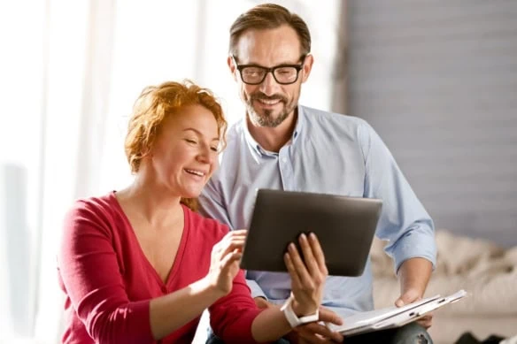 gen x couple looking at tablet together