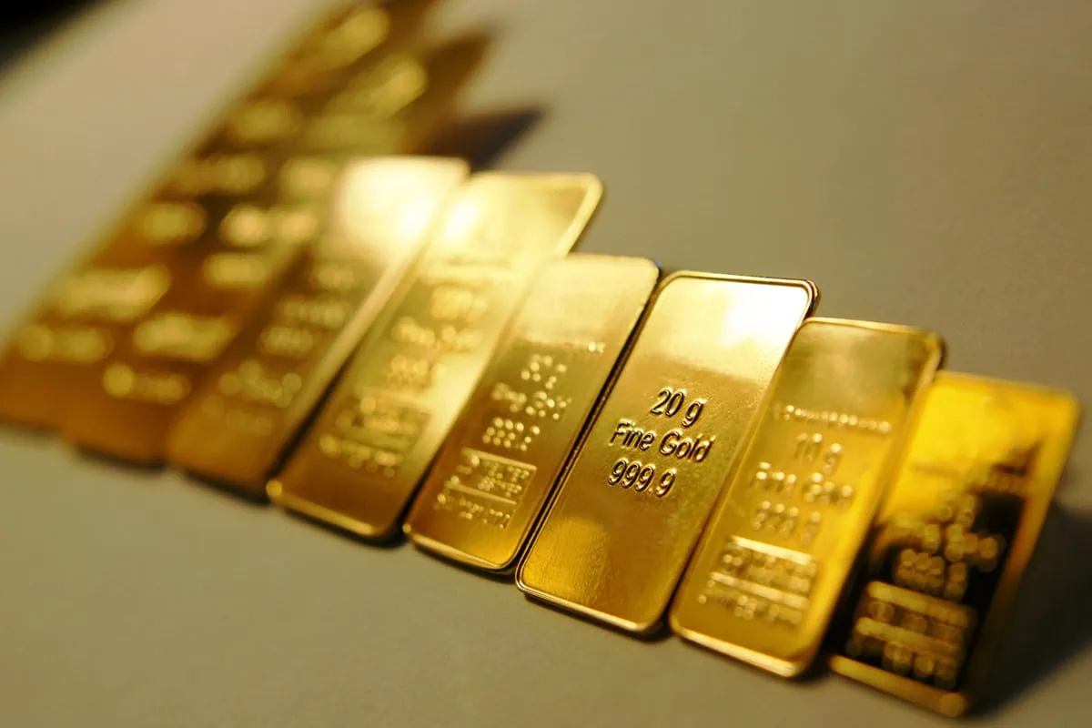 These 7 Gold ETFs Are Soaring as Gold Eclipses $4,000 5 gold bars of different sizes.