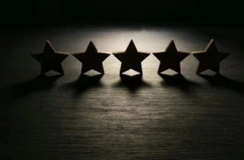 Five stars in the dark. Customer experience and satisfaction concept.