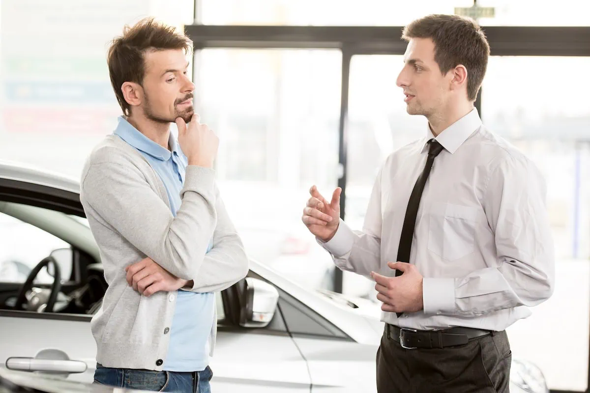 8 Ways to Save Money When Buying a Car 3 haggling car sales dealer