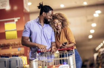 happy couple grocery shopping 1200
