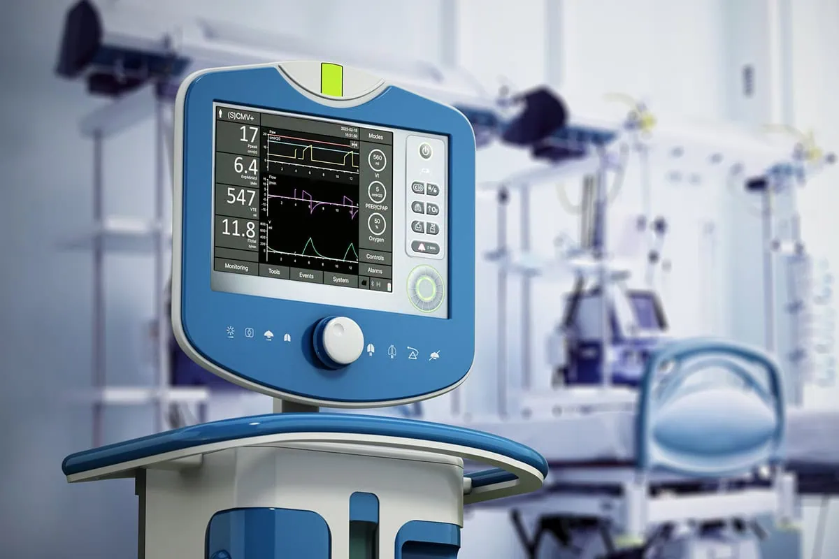 Medical ventilator device in hospital room.