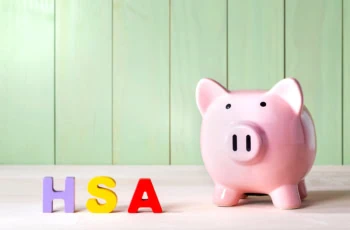 a piggy bank next to colorful letters spelling out H S A.