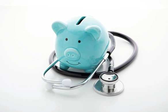 a blue piggy bank with a stethoscope wrapped around it.