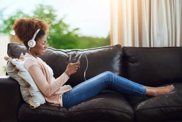 house sitting couch hustle headphones teen 1200