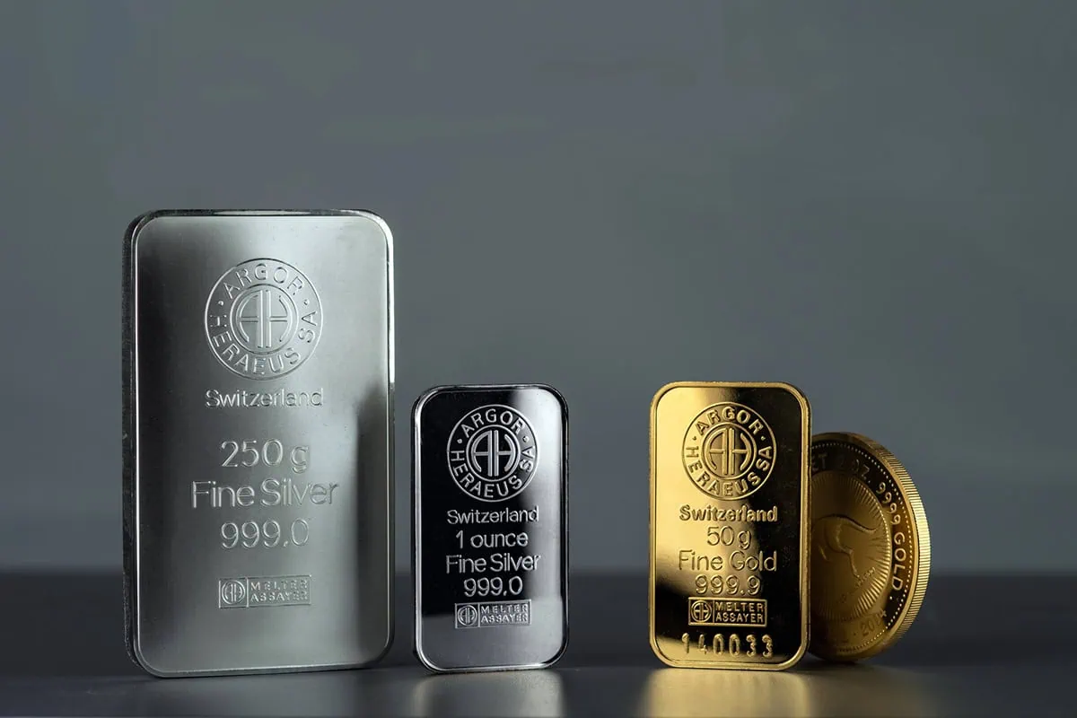 gold and silver bars and a gold coin.
