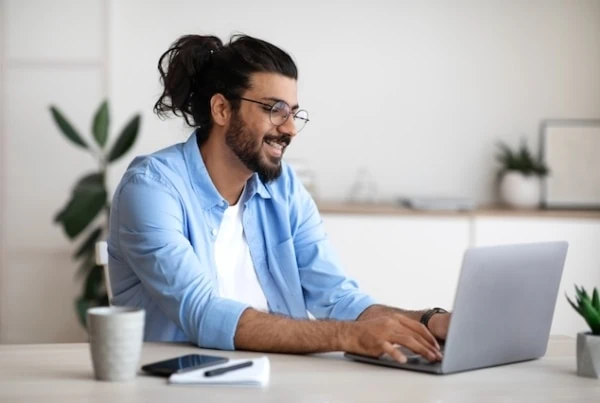 investment apps laptop happy freelancer