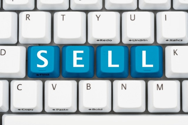 keyboard with sell spelled out in blue keys