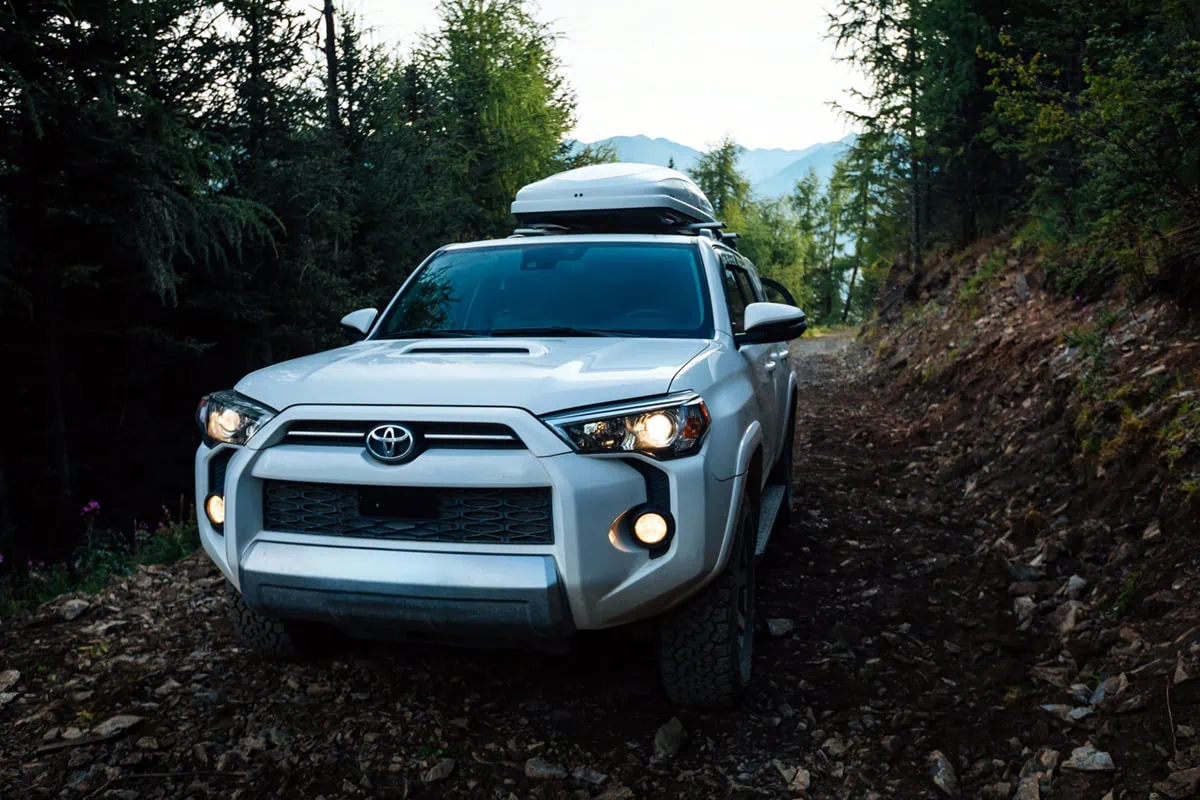 Fuel Savings Made Simple: 12 Practical Hacks to Slash Your Monthly Gas Costs 6 a toyota SUV with roof cargo.