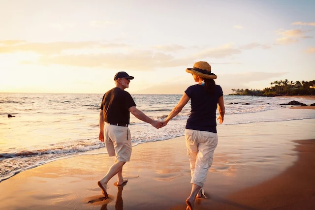 Senior Couple Enjoying Sunset at the Beach