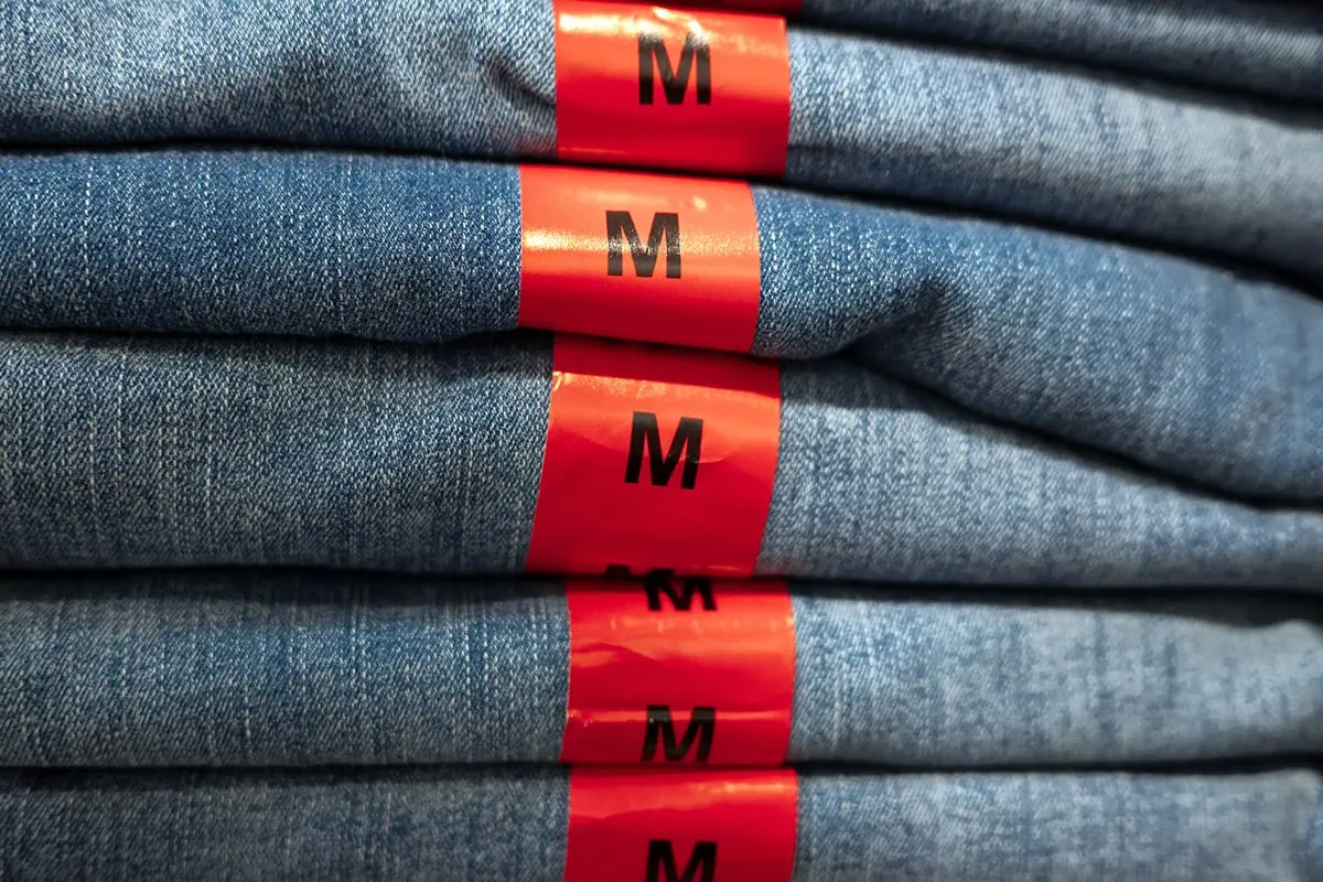 medium size tags on several pairs of jeans.