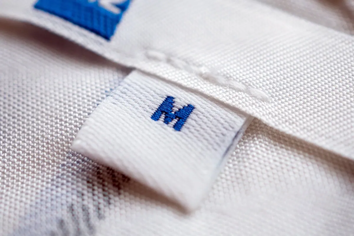 a medium size tag on a shirt.