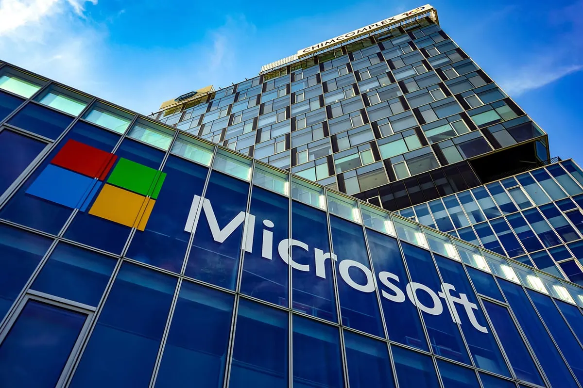 15 Stocks You Can Feel Good Holding Forever 13 the microsoft logo on the side of a glass building.