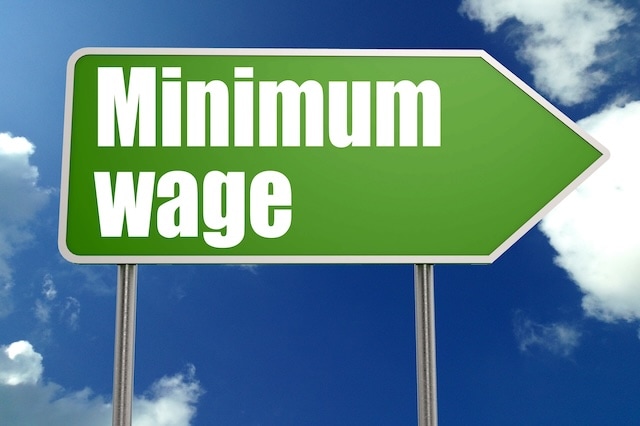 minimum wage highway road sign