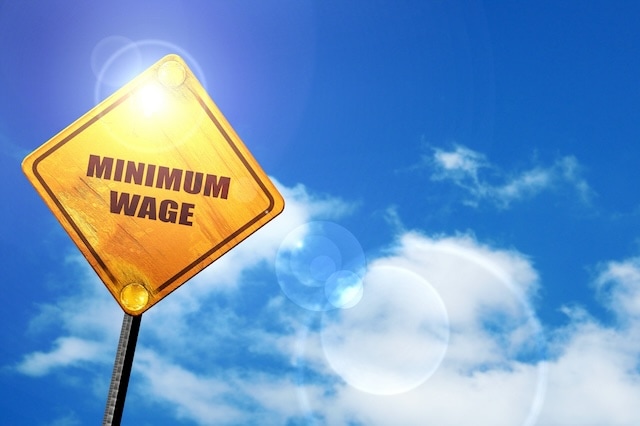 minimum wage road sign warning