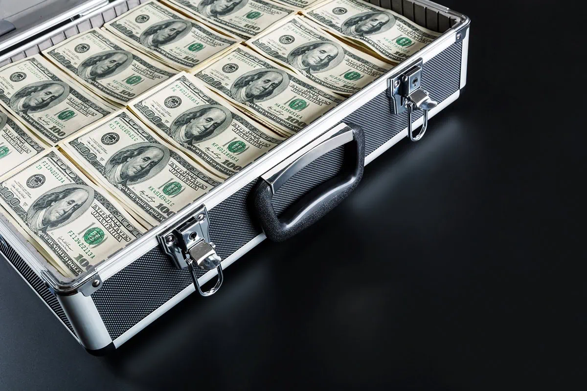 a briefcase full of hundred dollar bills.