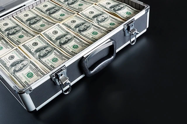 a briefcase full of hundred dollar bills.