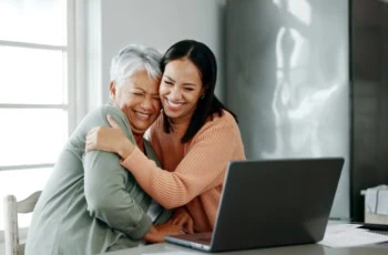 mother daughter financial caregiving laptop