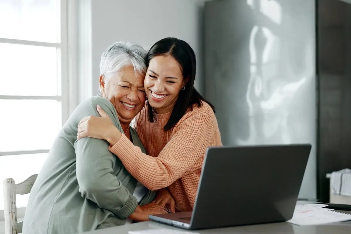 Generational Investing Differences: A Dozen Differences in How Baby Boomers and Gen Z Are Investing for Retirement 2 mother daughter financial caregiving laptop