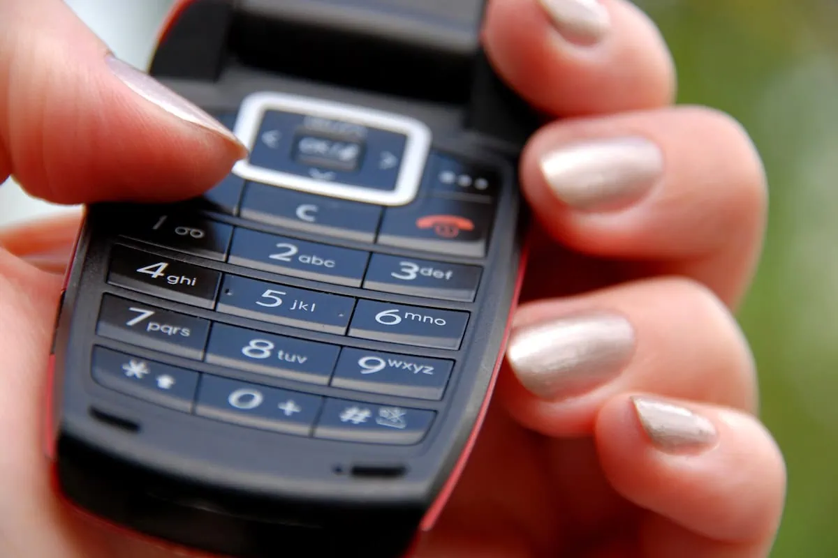 old technology dumb phone keypad 1200