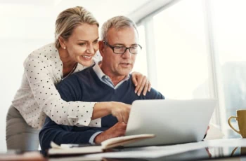 older couple looking at computer making decisions together