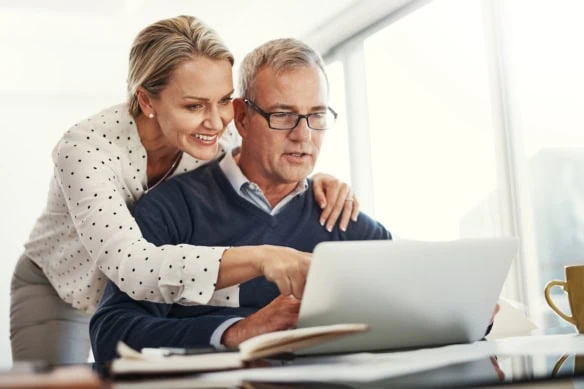 older couple looking at computer making decisions together