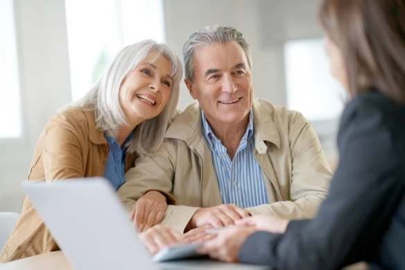 Senior couple meeting financial adviser for investment