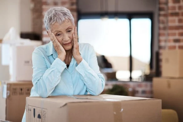 older woman deciding if she should move in retirement