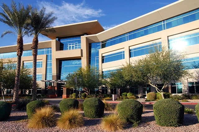 🏢 The Syndication Shortcut: How to Partner With Other Investors to Purchase Properties 9 a generic office building in sunlight.