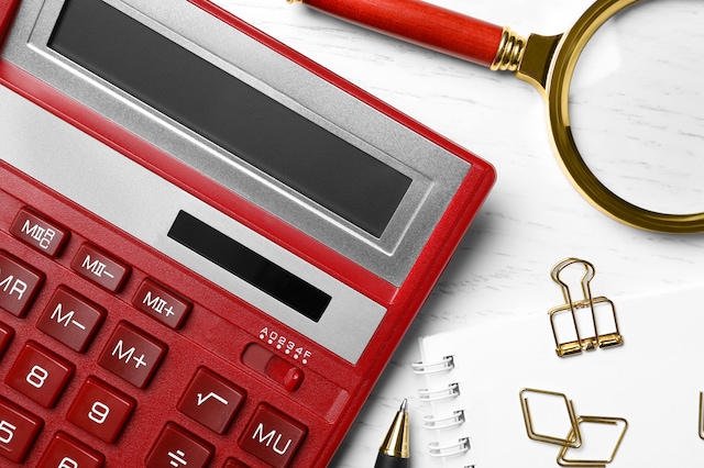 red calculator math accounting