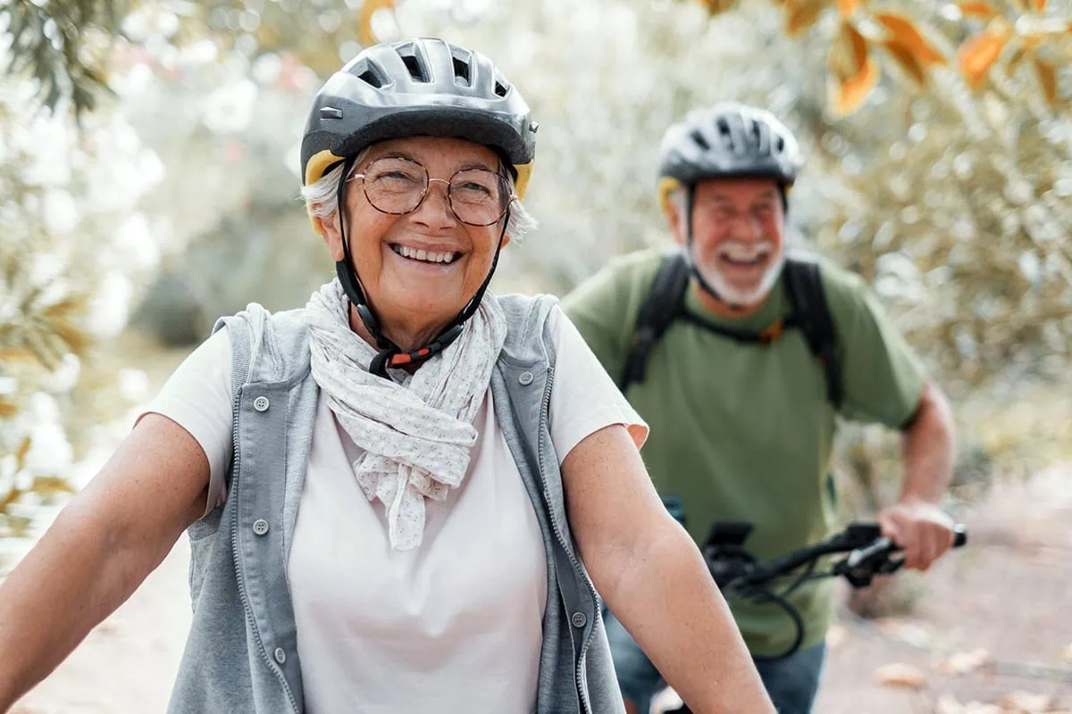 The Near Retirement Stress-Test: 10 Questions to Know If You're Ready 11 a senior husband and wife go mountain biking.