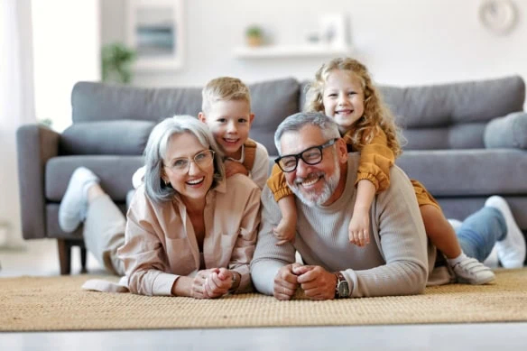 a cheerful family of grandparents and young children.