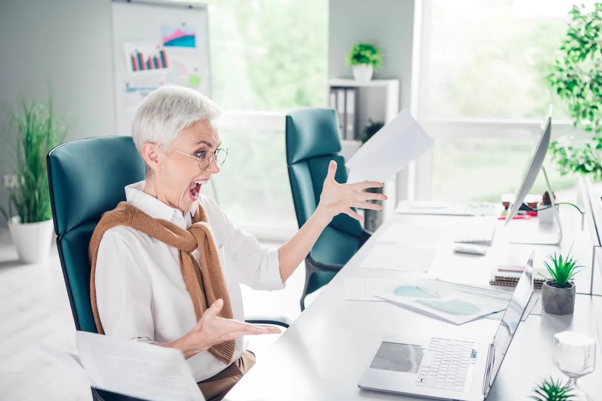 The 401(k) Course-Correction: 10 Warning Signs You’re Heading Toward a Retirement Trap 2 retirement mistakes office stress laptop pie chart 1200