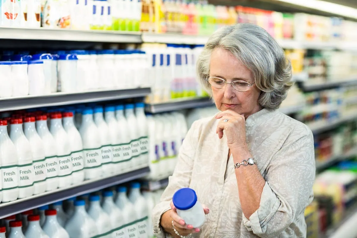 From Cart to Complaint: 10 Amazon Products You'll Regret Buying 12 Senior woman buying milk at the supermarket