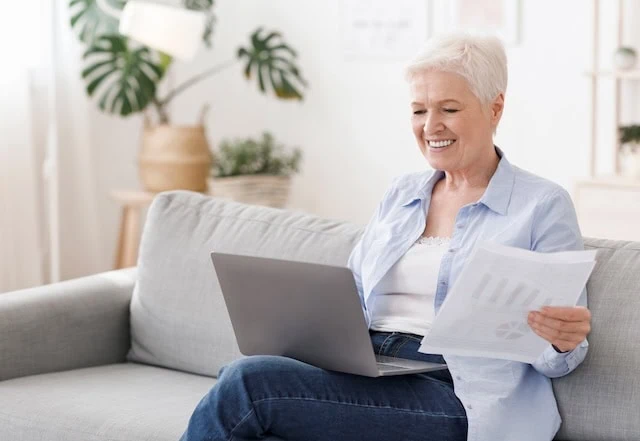 senior woman on laptop working