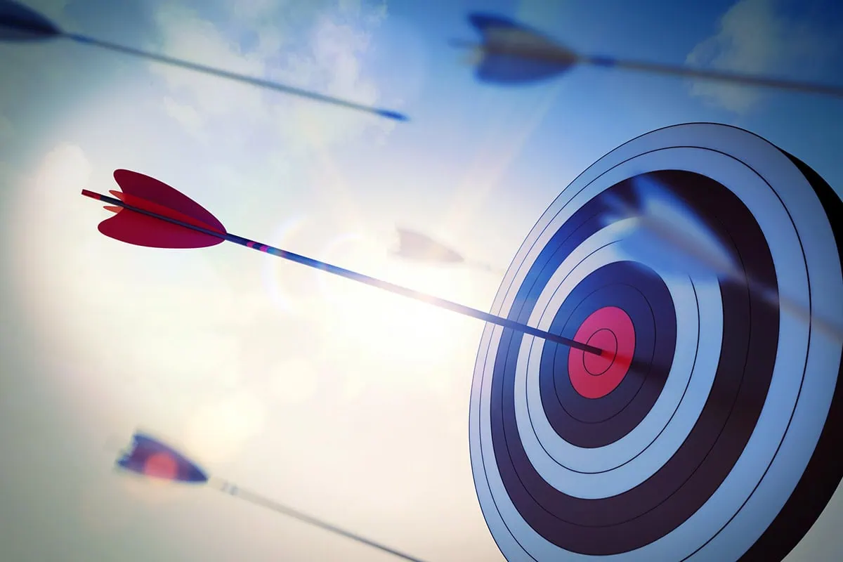 Save With Schwab: 8 Great Funds for Any Retirement Account 7 arrows hitting targets are blurred by a camera effect.