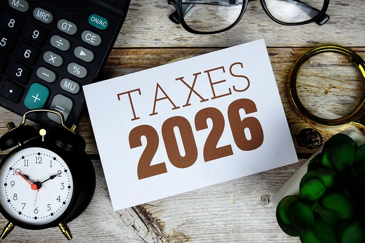 The 2026 Federal Income Tax Brackets: Which Are You In? 2 a card that says taxes 2026.