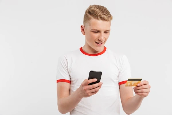 teen smartphone credit debit card white background