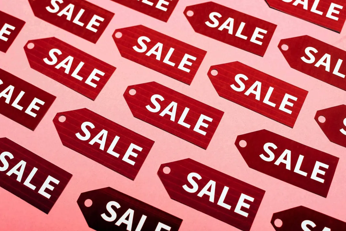 a group of sale tags.