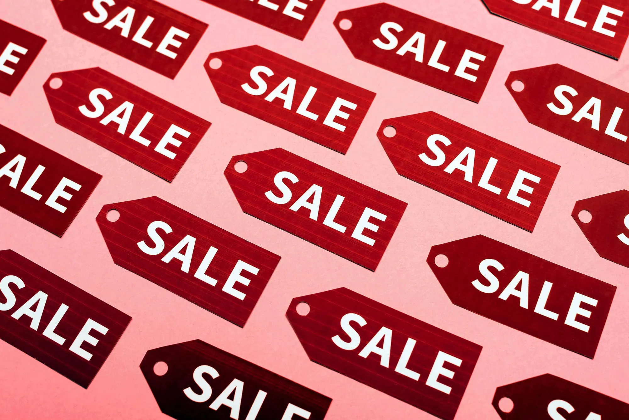 a group of sale tags.