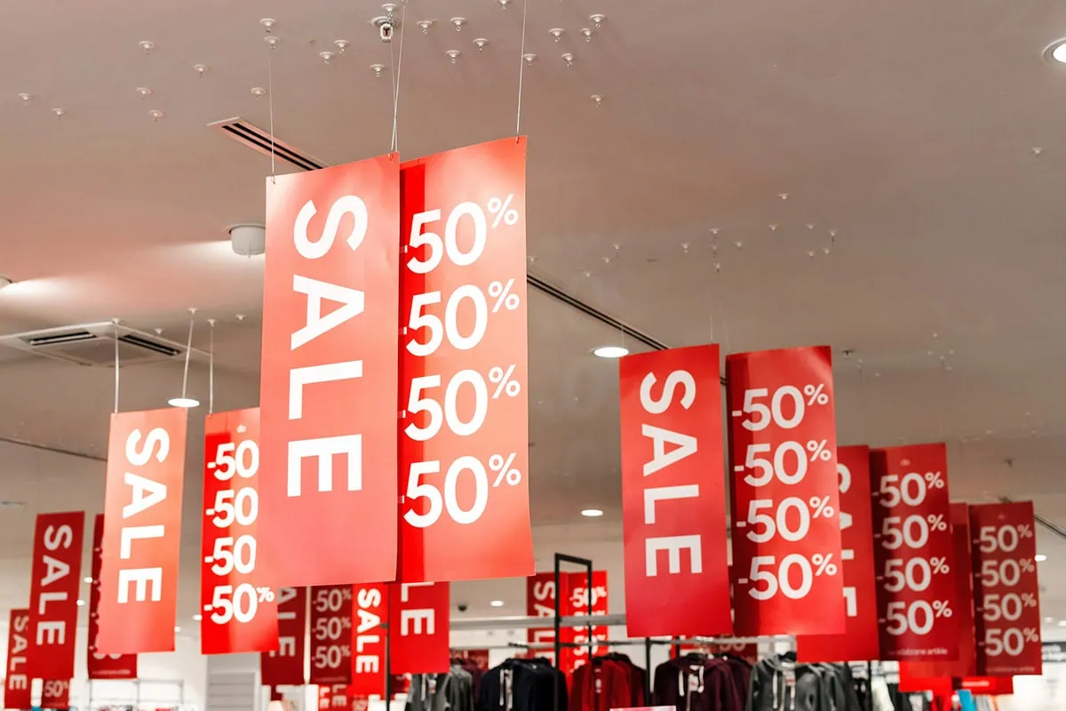 Fidelity's 9 Best ETFs: More Than Just 'Plain-Vanilla' Funds 4 a number of large sale sign banners hanging from the ceiling.