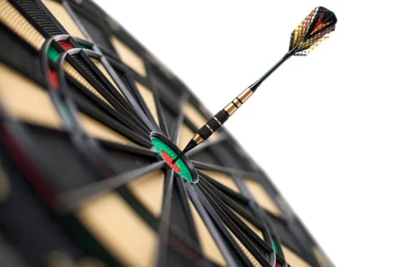 a multicolored dart hits a bullseye against a white background.