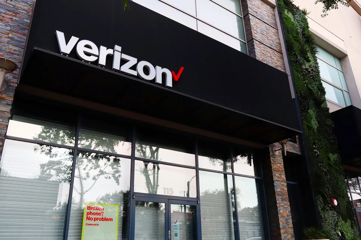 a verizon store with a large sign overhead.