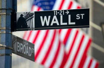 a sign saying wall street in new york city.