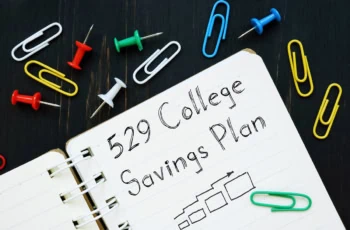 A notebook with 529 college savings plan written on it 1200.