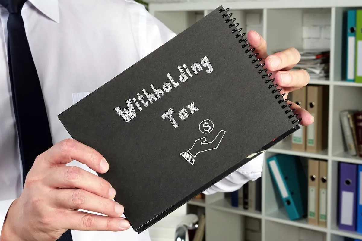 withholding tax written in notebook 1200