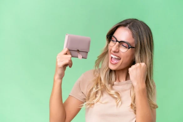 woman celebrating savings holding her purse